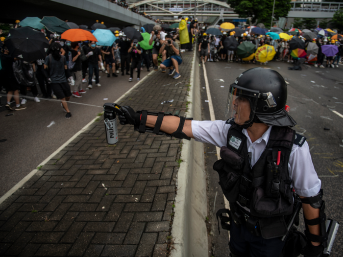 Police employed pepper spray and batons in an attempt to disperse the hundreds of protesters who started the day off by occupying the road that led to where the flag-raising ceremony was supposed to occur. The ceremony was eventually moved inside, which officials said was due to "inclement weather."