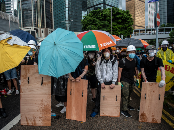 But, slates of violence erupted in other parts of the city, as protesters relied on homemade shields and umbrellas to protect themselves from police.