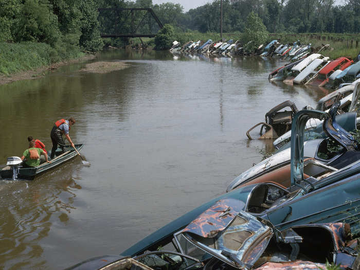 Its banks were rimmed with abandoned cars in some areas.