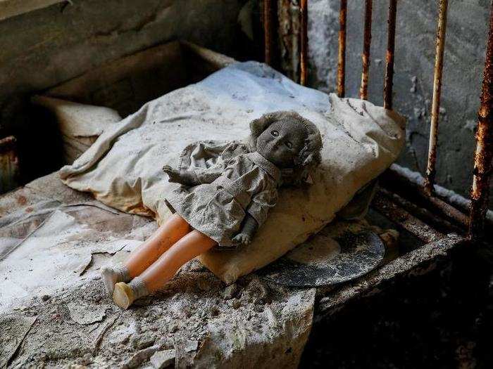 Tourists have arranged creepy dolls on abandoned beds and windowsills.