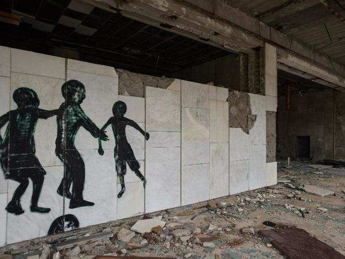 Graffiti artists drew strange, shadowy figures on the walls of buildings.