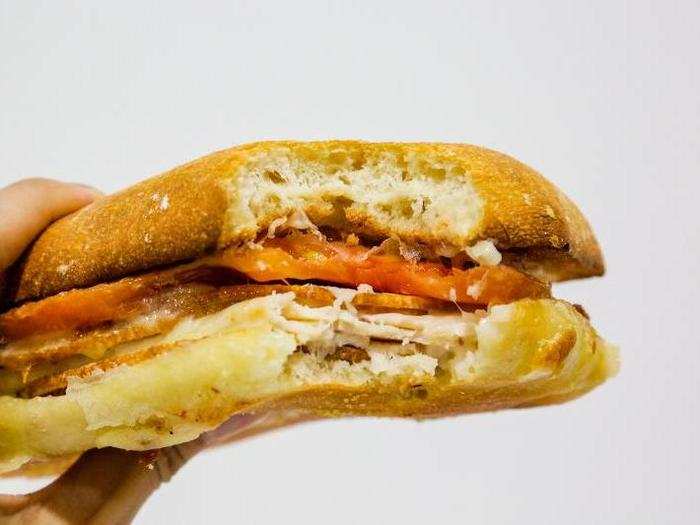 But while all the ingredients are there — bread, turkey, provolone, tomato, and pesto — the sum of their parts is less-than.