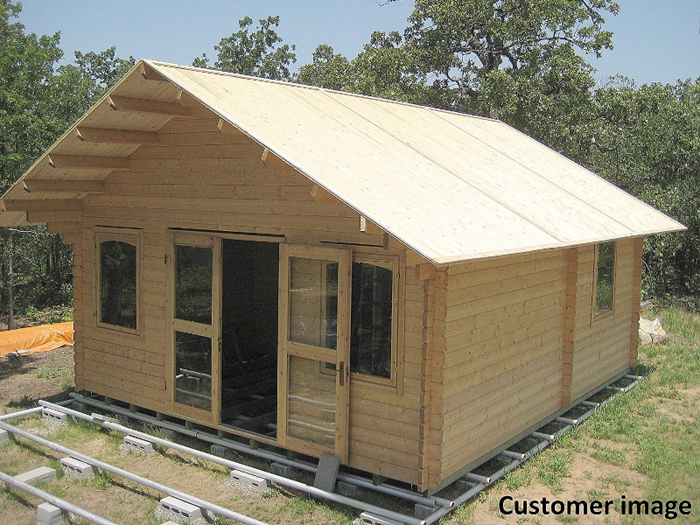 The all-wood home is advertised as a cabin and not a full-fledged residence, likely because the tiny home only comes with bare materials and few features.