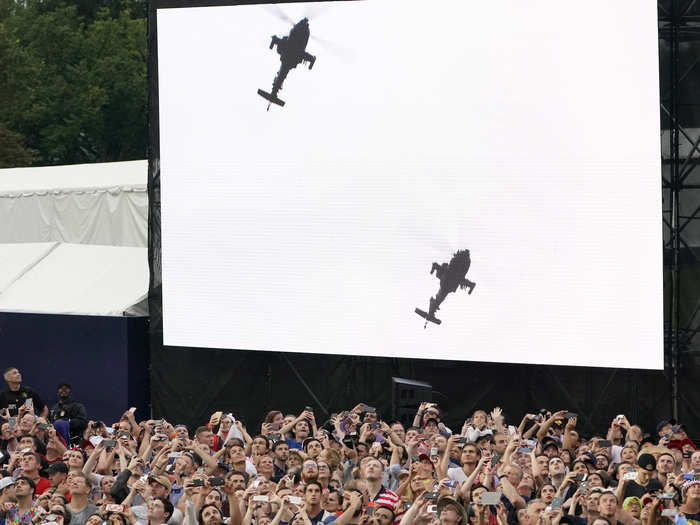 The crowds could be seen watching the displays on giant screens, and taking photos and videos.