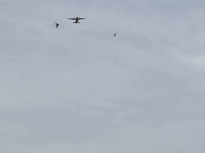 Three Coast Guard aircraft then zoomed overhead as Trump regaled the crowd with Coast Guard actions during World War II.