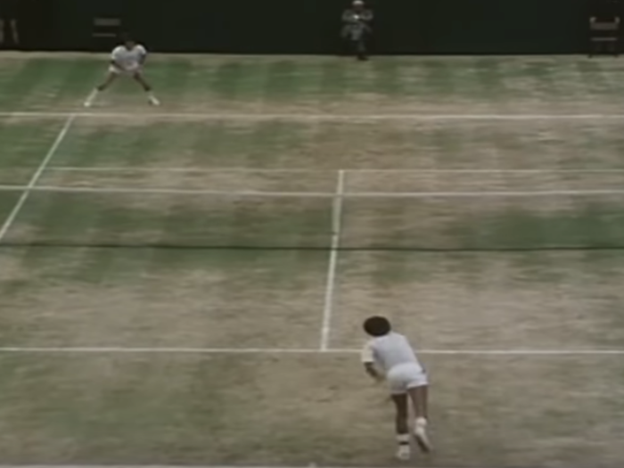 1975 (Arthur Ashe defeated Jimmy Connors) — The dead spots are still widespread, but we start to see some small area of grass where it is not worn down.