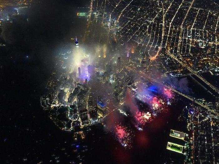 You can see One World Trade Center through the smoke from the fireworks.