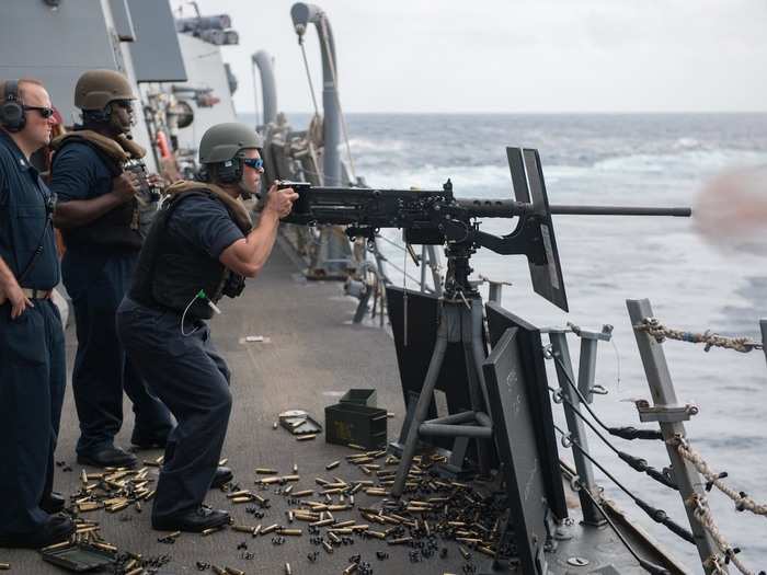 Sailors aboard the Dunham man a .50-caliber machine gun during a gunnery exercise in November 2018.