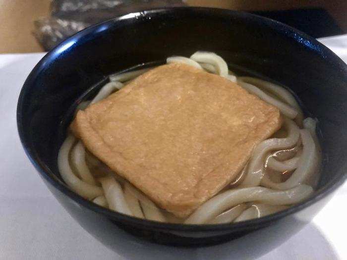 Before we landed, the flight attendants came by to offer a final light meal. Who was I to say no? I had the udon noodles with deep-fried tofu, which, despite the fact that we were on an airplane, was actually crispy...