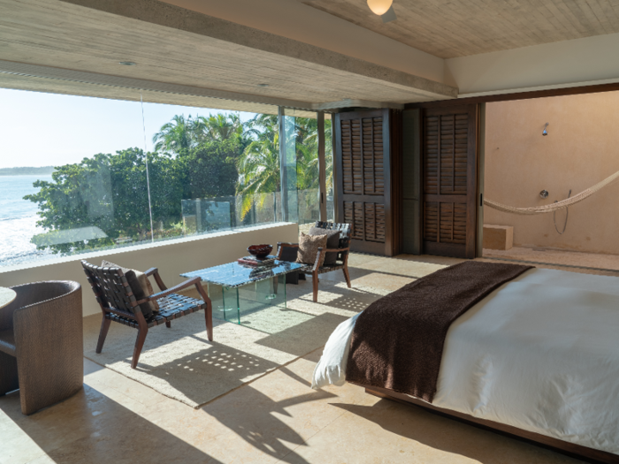 The second-floor master suite features a wall made almost entirely of glass that overlooks the ocean.