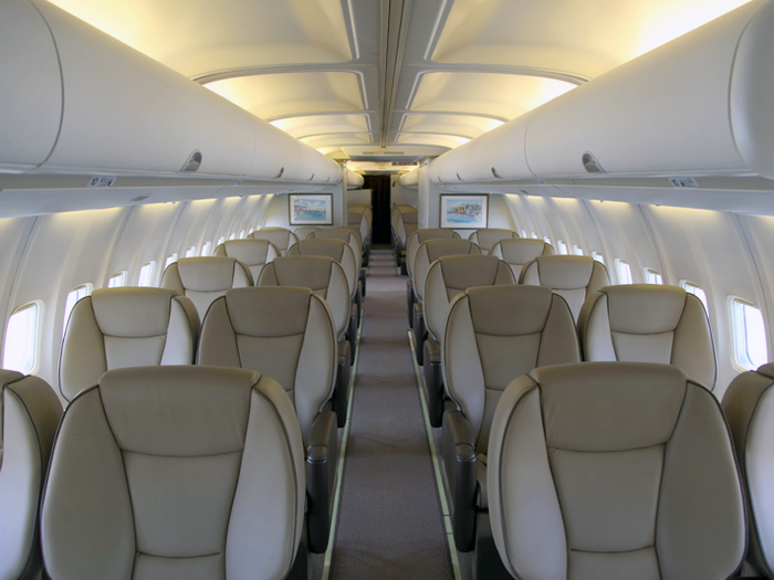 The plane is configured to seat up to 62 people, with both traditional seating...