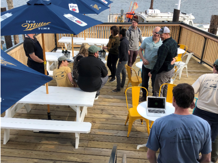 After he arrives at the Portland Pier location, Holden checks in with Denny, the wharf manager, to "take the pulse of the fishermen" and check on operations at the buy station. Then he meets with the 100-person team in the restaurant to see how the chef and general manager are dealing with the large volume of guests they