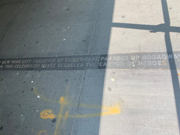 As I walked along Broadway, I read every plaque embedded in the sidewalk, commemorating past parades. This one, at Bowling Green, introduces the Canyon of Heroes.