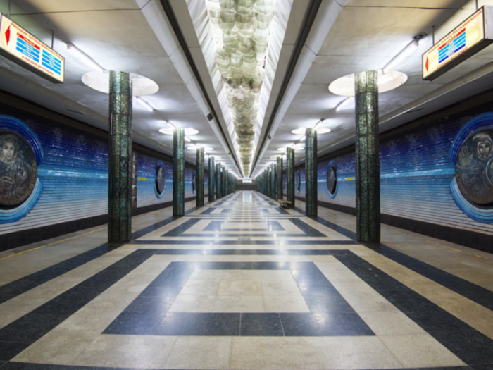 This artwork is in the Kosmonavtlar Station, which translates to Cosmonauts Station. It has a space theme and contains multiple portraits of astronauts, including Valentina Tereshkova, the first woman to fly to space.