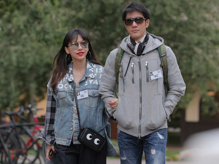 Wang Jiali (left) walks with Wang Leehom (right), a celebrated actor-director-producer-singer-songwriter.