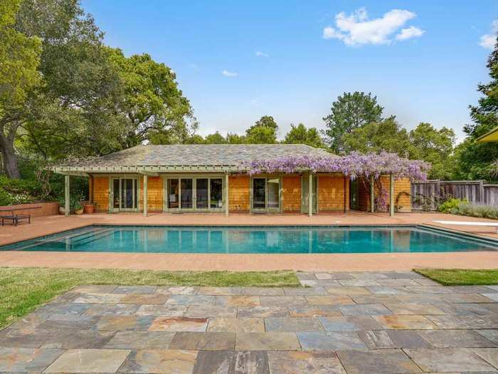 So too does a pool house, which includes a sleeping area, full bathroom, and kitchen — perfect to use as a place to hang on a hot summer day or as a separate guest house.