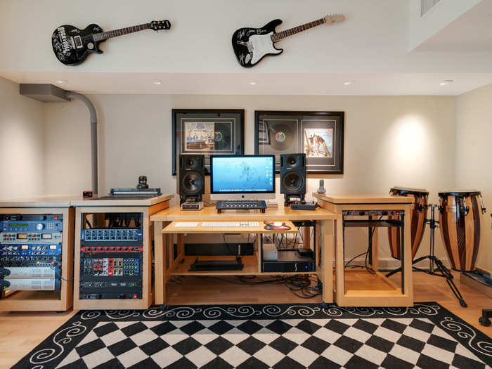 There is no shortage of instruments in the "office" — especially guitars, which Oates played in his band, CHOC