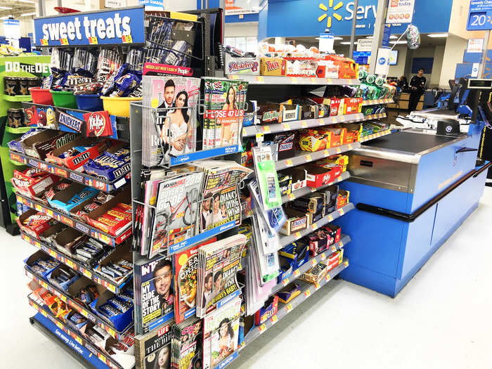 ... but assisted checkout lines featured cold cases for water and soft drinks, loads of candy, and some sort of featured impulse-buy item at the head of the aisle.