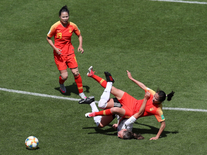 ... another awkward twisting of limbs by Melanie Leupolz of Germany after she collided with Team China