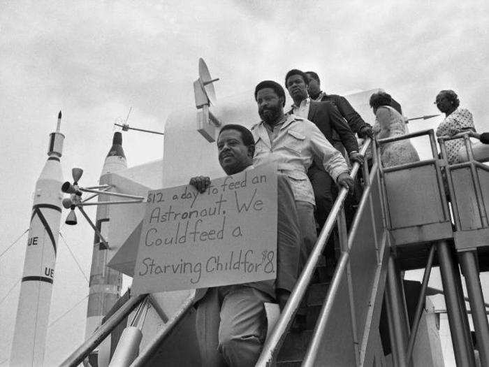 A few days before the rocket launched the Apollo 11 crew into space, about 500 people protested the moonshot program outside the Kennedy Space Center.