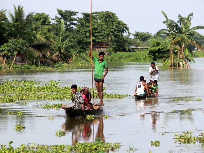 Hajo: People collect water pouches in flood hit Hajo.