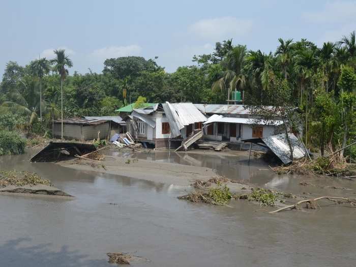 A house destroyed by floods in Athgaon village of Assam