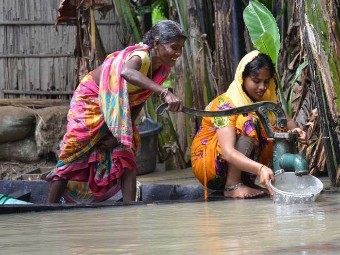 Water woes: Women seen busy collecting water from a hand pump in Morigaon.