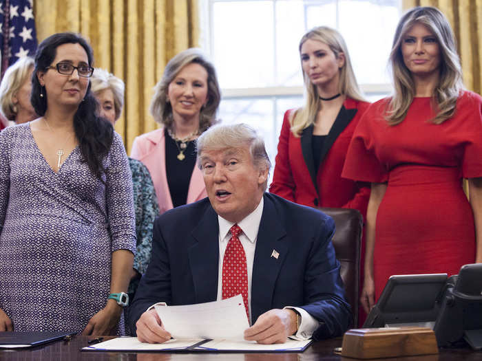 She was also notably pictured at his side with female lawmakers in the Oval Office when he signed a bill to promote women