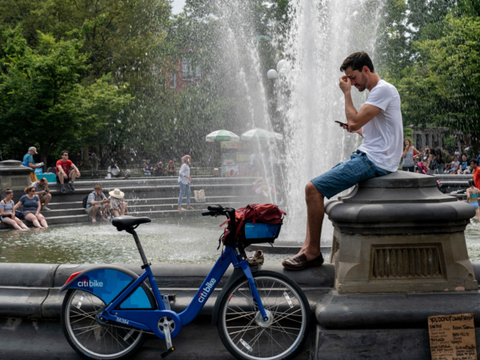 Frequent breaks from exercise are a good call — like this biker, resting by the fountain in Washington Square Park, New York.