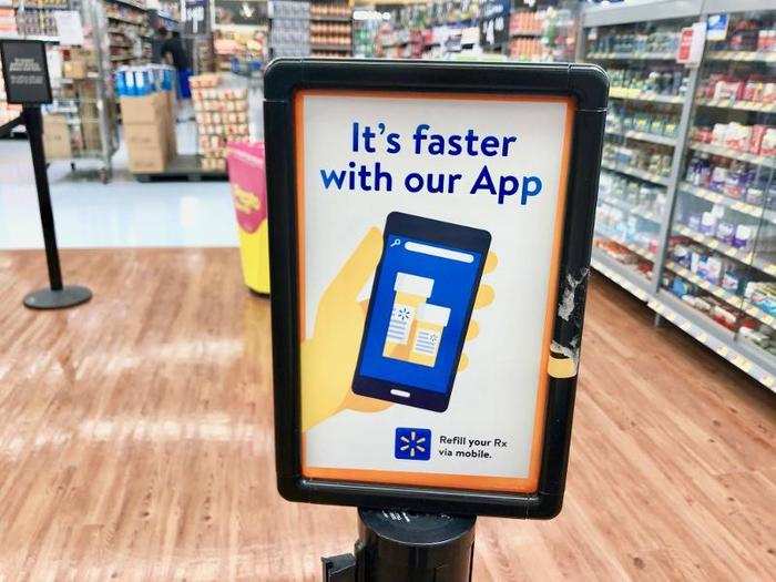 By the pharmacy line, there was a sign advertising the Walmart app, which helps customers manage and refill their prescriptions.