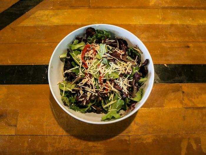 SIMPLE SALAD — I regretted not customizing my salad, because all that was in this were mixed greens, roasted red peppers, and asiago cheese.