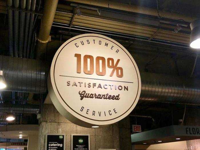 Like Walmart, Whole Foods had signs advertising a satisfaction guarantee.