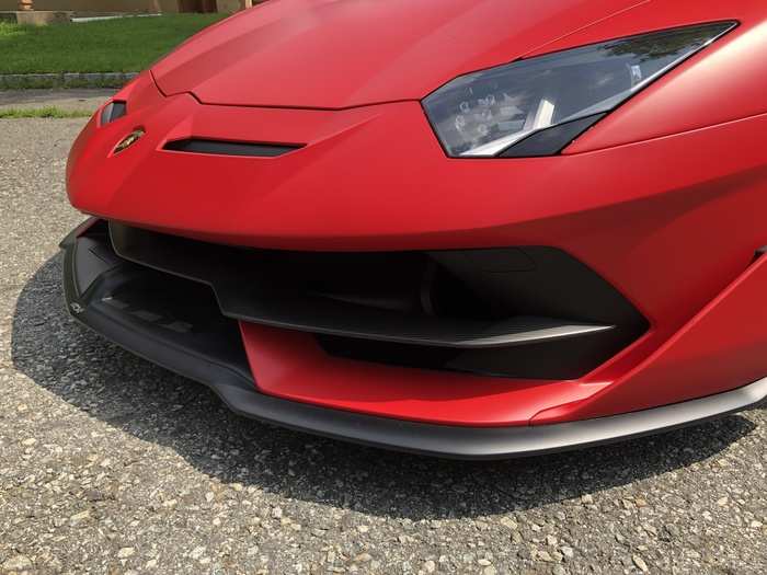 ... Where a "floating" front splitter adds downforce and improves airflow.