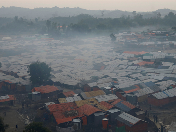 In the evening, a haze forms over the camp from cooking fires.