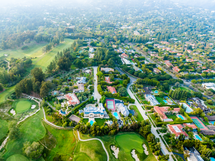 Known as "Mi Patria," it has nine bedrooms and eight bathrooms. It also has a library, courtyard, gourmet eat-in kitchen, and tropical gardens.