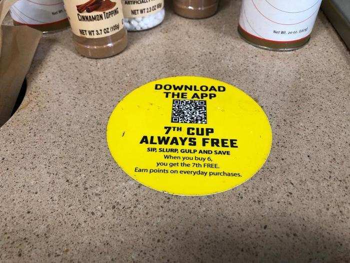 Near the coffee, a sticker reminded customers to download the 7-Eleven app to reap the best rewards while shopping.