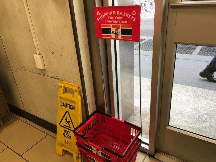 The front of the store had baskets for shoppers to store their items while they shopped.