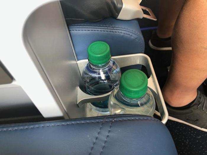 In the front of the armrest and down at seat level, there was a water bottle holder with mini bottles waiting for us. This was actually pretty easy to miss, I didn