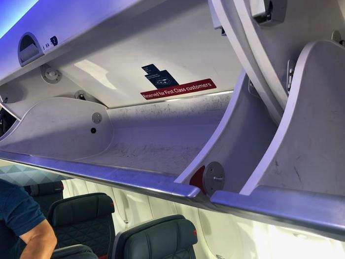 A bragging point of the A220 is its spacious overhead storage bins — these can fit most standard carry-on bags that you