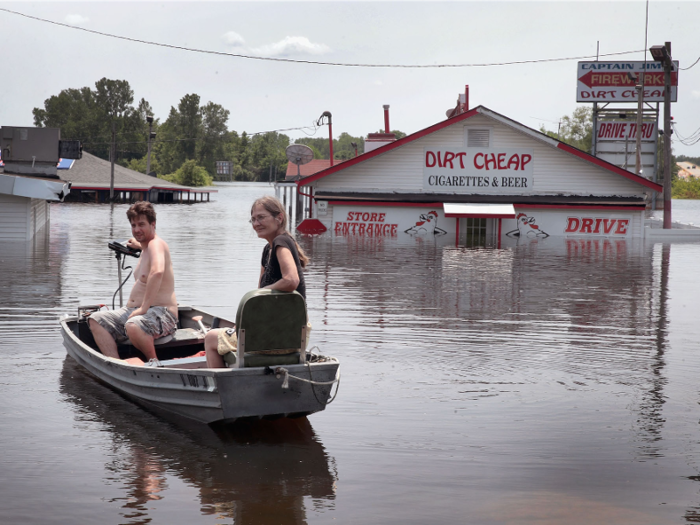 After the floods, a boat is the best way to get home in West Alton, Missouri.