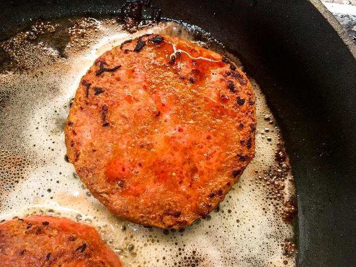 As they cooked, they shrank much like real burgers, and a red oily film oozed from their skin.