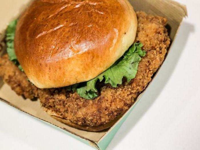 BUN: What a gorgeously brown, buttery, toasted potato brioche. It was sweet and light but tough — perfect for holding a tile of chicken the size of my face. TEXTURE: It was wonderfully crispy, but the breading was kind of dark, and the chicken was a little chewy and too bready.