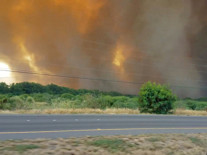 The fire began with 20 mph winds and covered 9,000 acres.