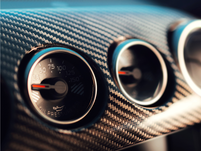 Classic Mustang gauges are framed in carbon fiber.