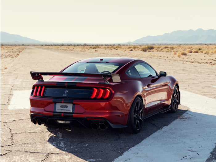 The rear of the Shelby GT500 can be dominated by a massive carbon-fiber spoiler, derived from the GT4 racing series, if you opt for that package when the 