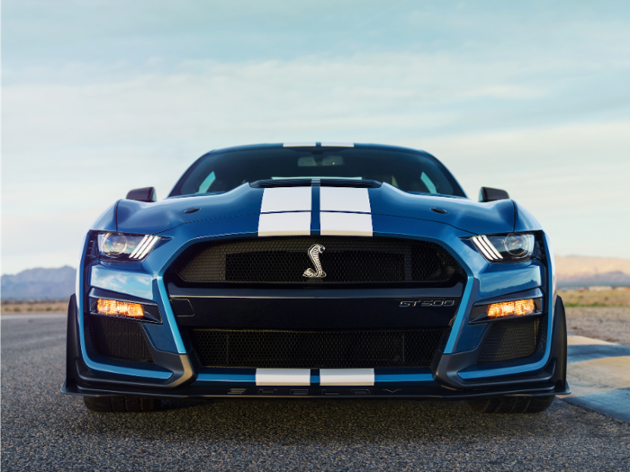 Six heat exchangers for the supercharged V8 hide behind that Cobra badge. And the functional louvered hood vent increases aerodynamic downforce.