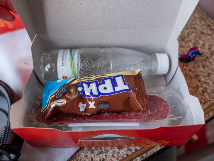 Dinner also came with an additional little box with a water bottle, some packaged salami, a cookie that was something like an Oreo knockoff, and plastic utensils.