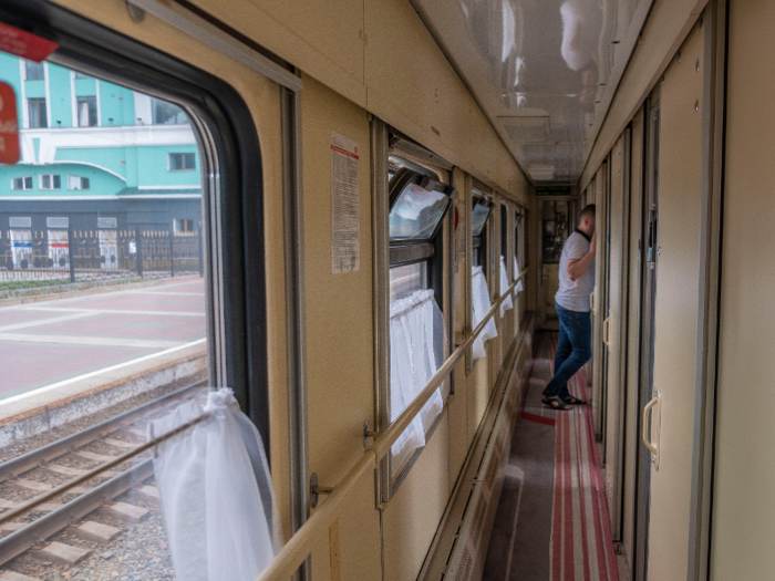 The train corridor was narrow. In order for two people to pass, they