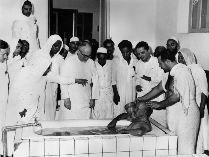 But the high temperatures are nothing new. Seen here is a pilgrim being given a cold bath to cope with the heat in 1967.