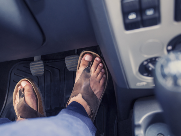 Wearing flip-flops while driving in Spain comes with a €200 fine.
